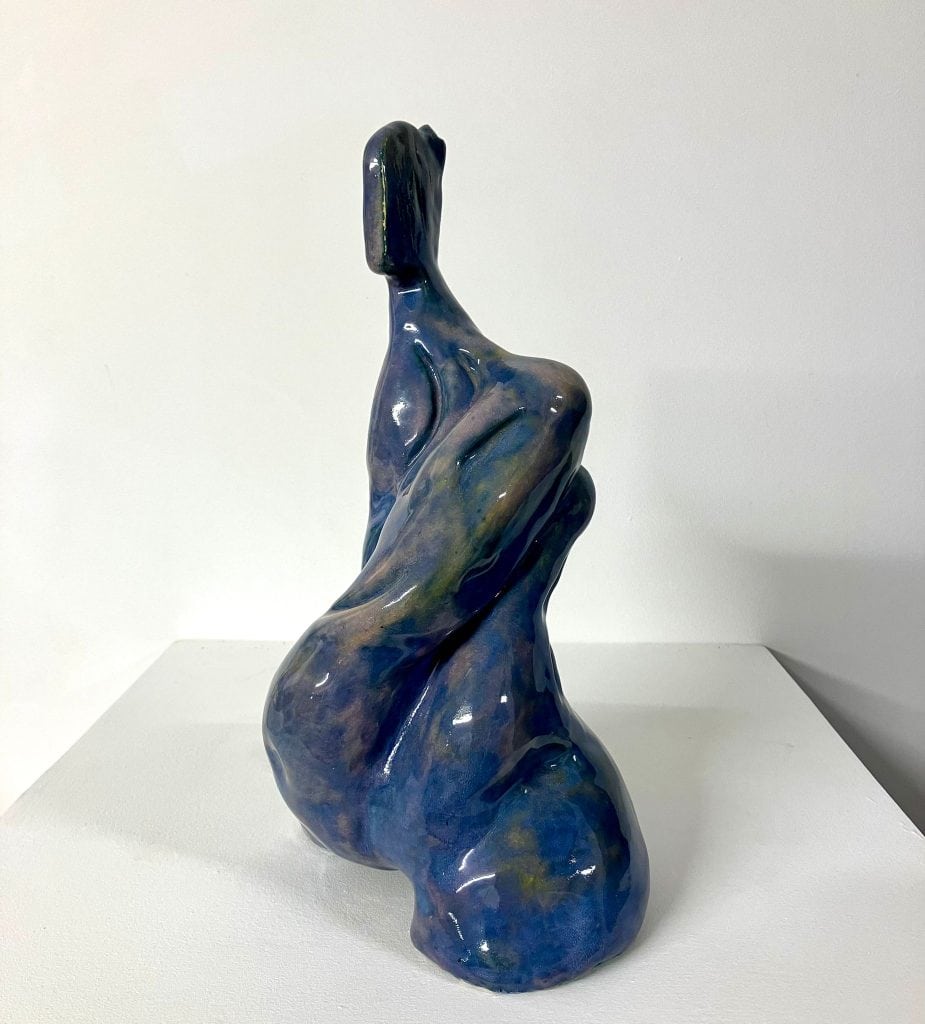 Ceramic figure of contemporary expectant mother